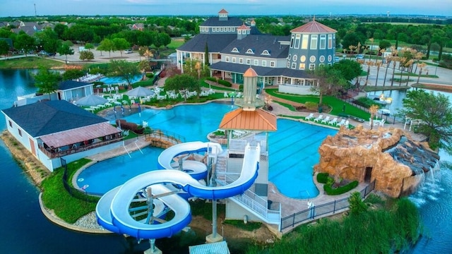 view of pool featuring a water view