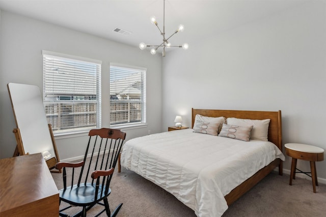 bedroom with a chandelier and carpet