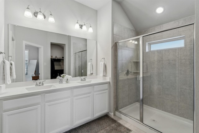 bathroom with vanity, tile patterned flooring, and a shower with door