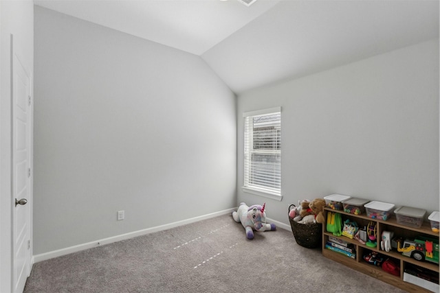 recreation room with vaulted ceiling and carpet floors