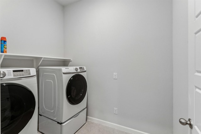 clothes washing area with washer and dryer