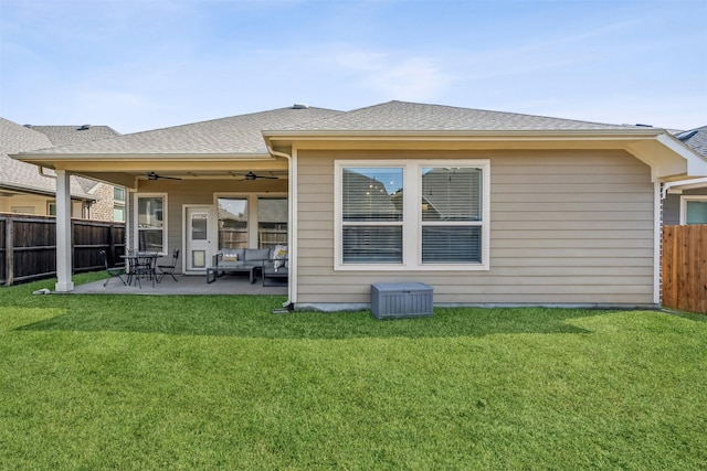 back of house with a lawn, ceiling fan, and a patio area