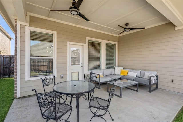 view of patio with an outdoor living space and ceiling fan