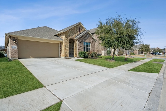 view of front of house featuring a garage and a front yard