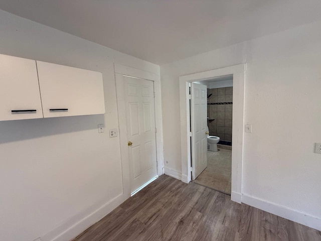 8112 Melrose St E, White Settlement, TX 76108 - hall with baseboards and dark wood finished floors