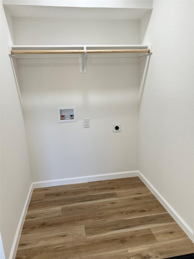 clothes washing area featuring hookup for an electric dryer, hookup for a washing machine, and hardwood / wood-style floors