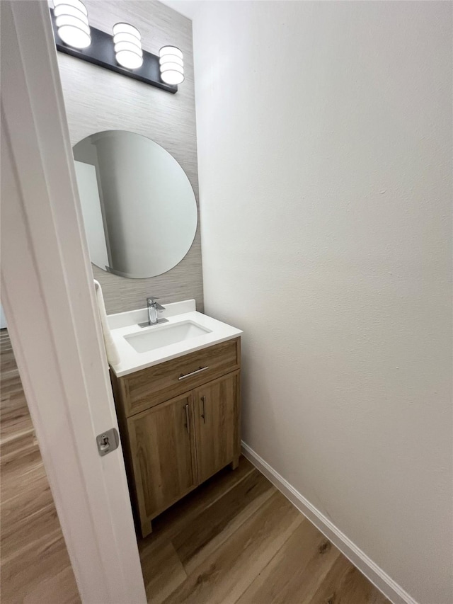 bathroom featuring vanity and hardwood / wood-style floors