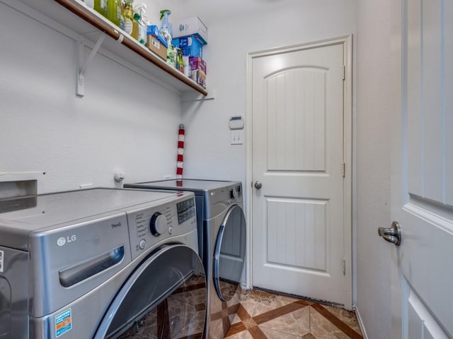 laundry area with washing machine and clothes dryer