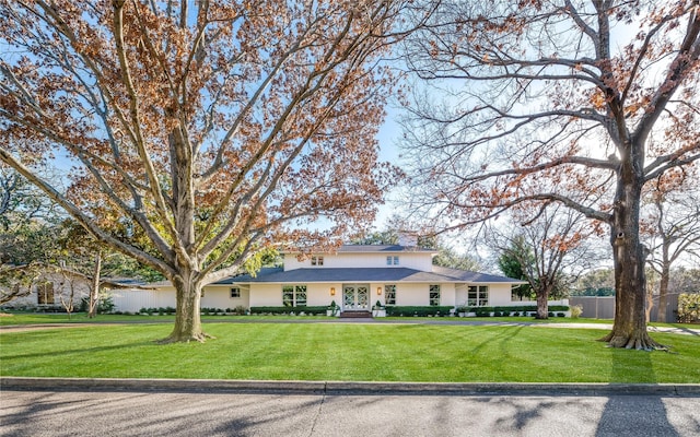 ranch-style house with a front yard