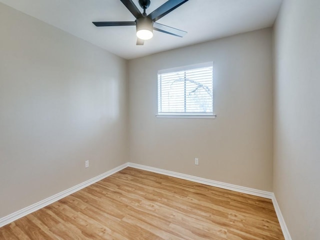 empty room featuring ceiling fan and light hardwood / wood-style flooring