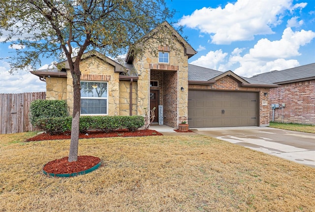 view of front facade with a garage and a front lawn