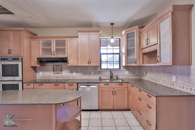 kitchen featuring pendant lighting, sink, light tile patterned floors, stainless steel appliances, and decorative backsplash