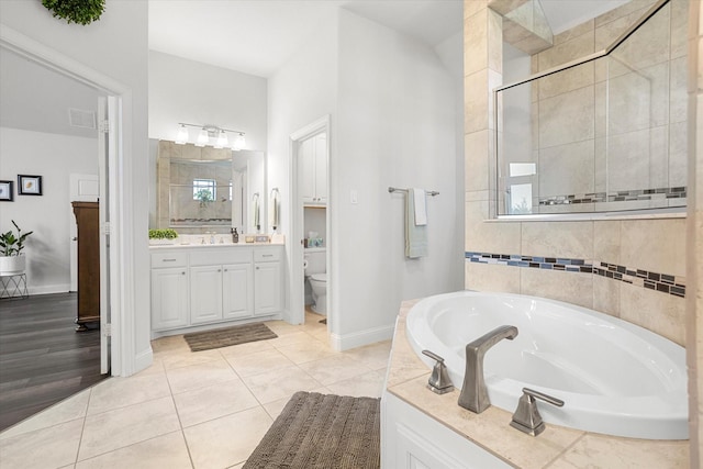 bathroom with a garden tub, visible vents, a stall shower, vanity, and tile patterned flooring