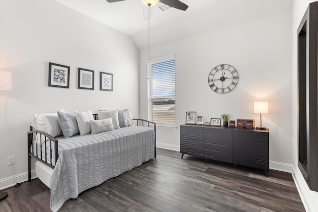 bedroom with lofted ceiling, visible vents, baseboards, and dark wood-type flooring