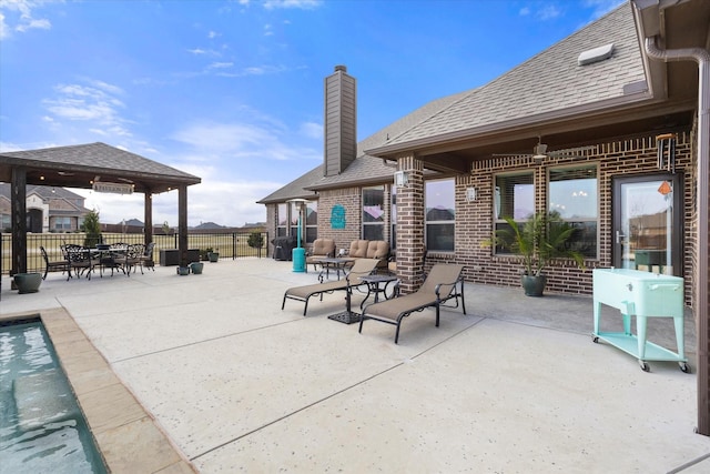 view of patio featuring a fenced in pool, fence, and a gazebo