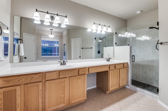 bathroom featuring a shower with door, vanity, and tile patterned flooring