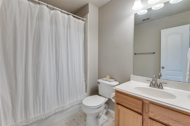 full bathroom with vanity, toilet, and shower / tub combo