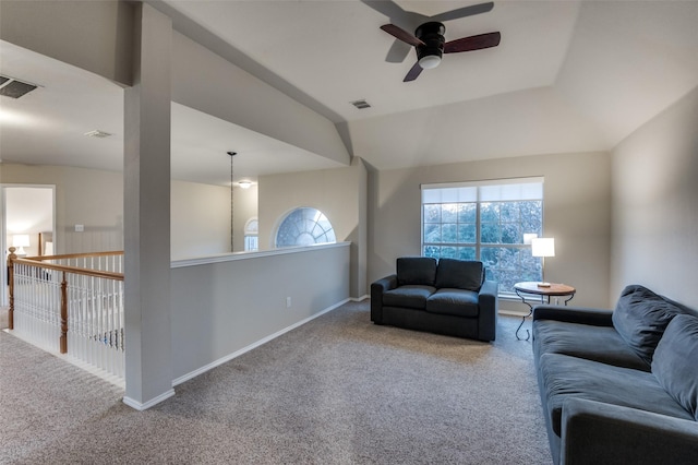 carpeted living room with lofted ceiling