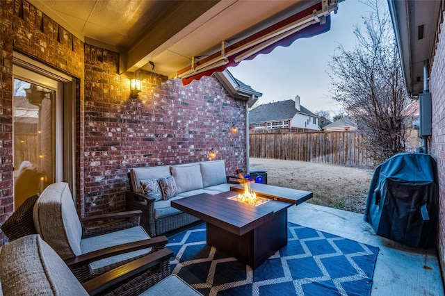 view of patio featuring an outdoor living space with a fire pit and grilling area