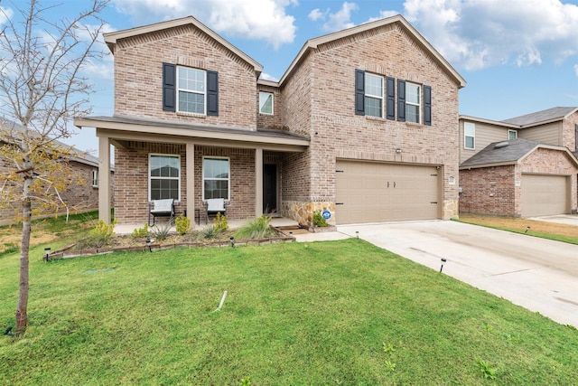 view of front of property featuring a garage, covered porch, and a front yard