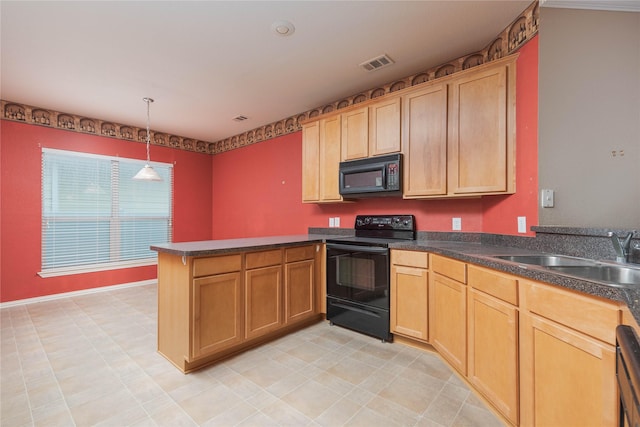 kitchen with decorative light fixtures, kitchen peninsula, sink, and black appliances