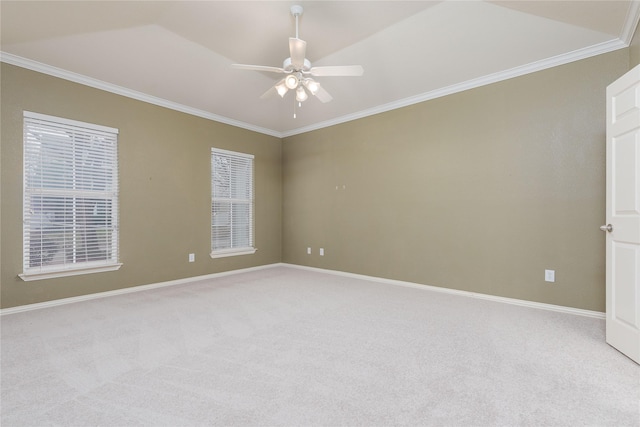 carpeted spare room featuring ornamental molding and ceiling fan