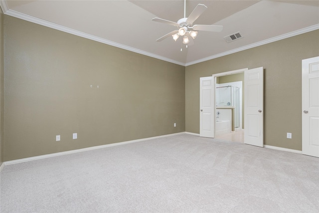 unfurnished bedroom featuring ceiling fan, light colored carpet, ornamental molding, and ensuite bathroom