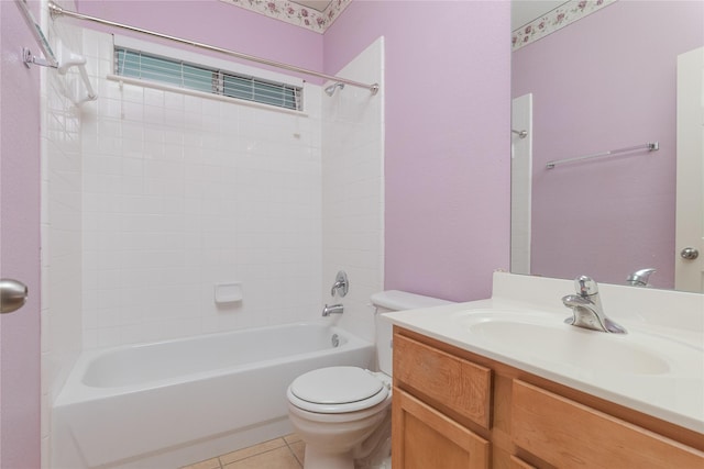 full bathroom with tiled shower / bath, vanity, toilet, and tile patterned flooring