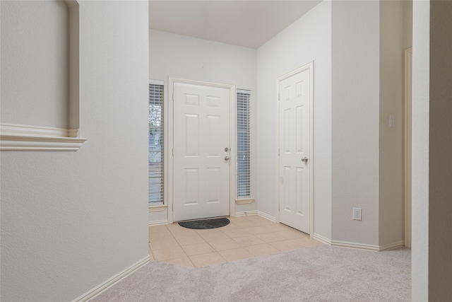 entrance foyer featuring light carpet