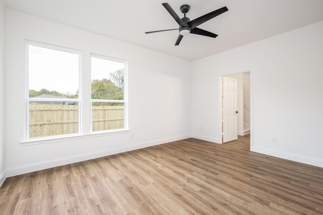 unfurnished room featuring light hardwood / wood-style floors and ceiling fan