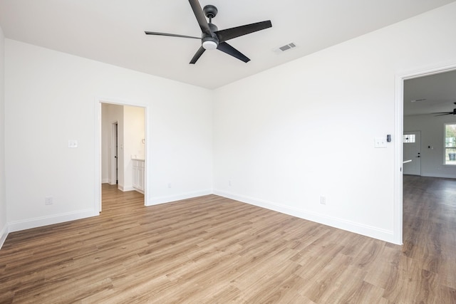 empty room with ceiling fan and light wood-type flooring