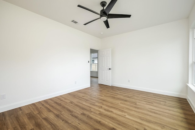 spare room featuring ceiling fan and light hardwood / wood-style floors