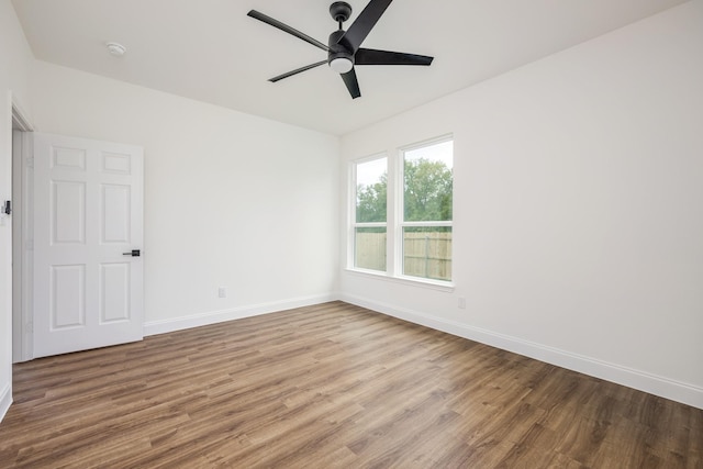 spare room featuring ceiling fan and hardwood / wood-style floors