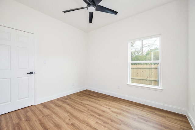 unfurnished room featuring light hardwood / wood-style flooring and ceiling fan