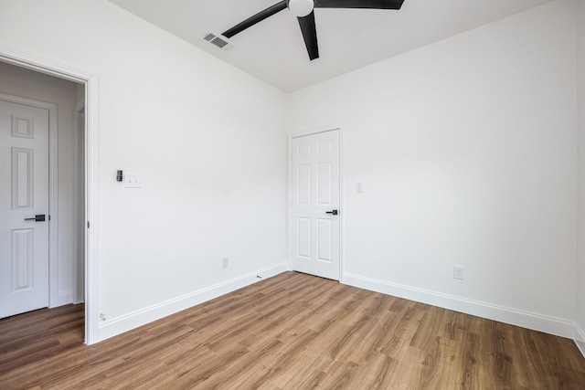 unfurnished room with wood-type flooring and ceiling fan