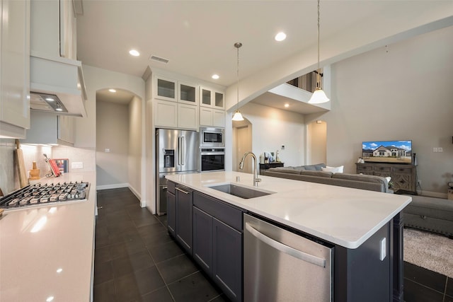 2402 Topaz Dr, Rockwall, TX 75087 - kitchen featuring sink, white cabinetry, a center island with sink, pendant lighting, and stainless steel appliances