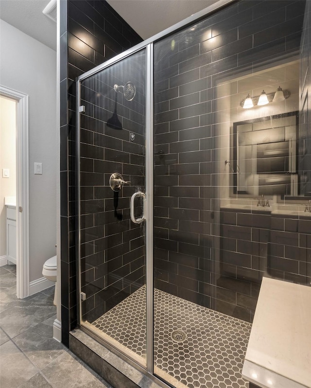 2402 Topaz Dr, Rockwall, TX 75087 - bathroom featuring toilet and a shower with door