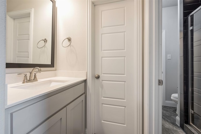 2402 Topaz Dr, Rockwall, TX 75087 - bathroom with vanity, toilet, and a shower with door