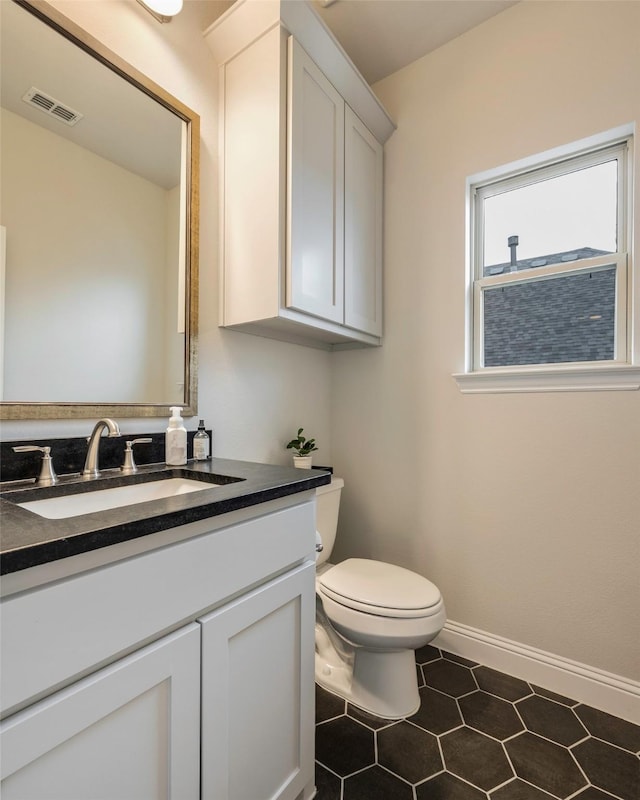 2402 Topaz Dr, Rockwall, TX 75087 - bathroom with tile patterned flooring, vanity, and toilet