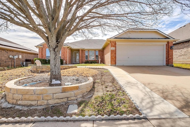 single story home with a garage, brick siding, and driveway