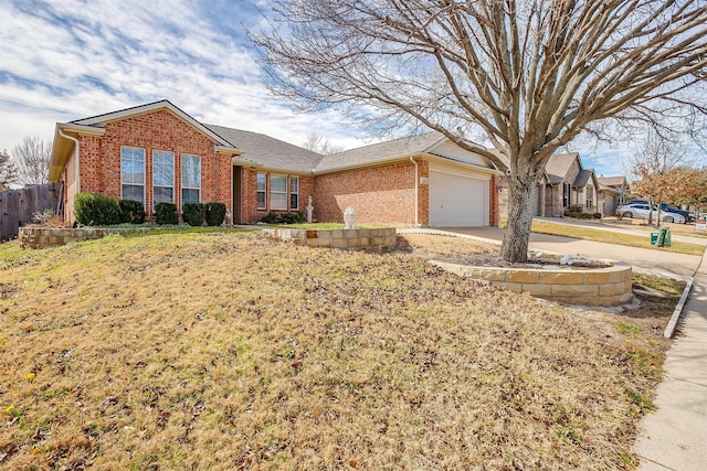 single story home with brick siding, driveway, a garage, and fence