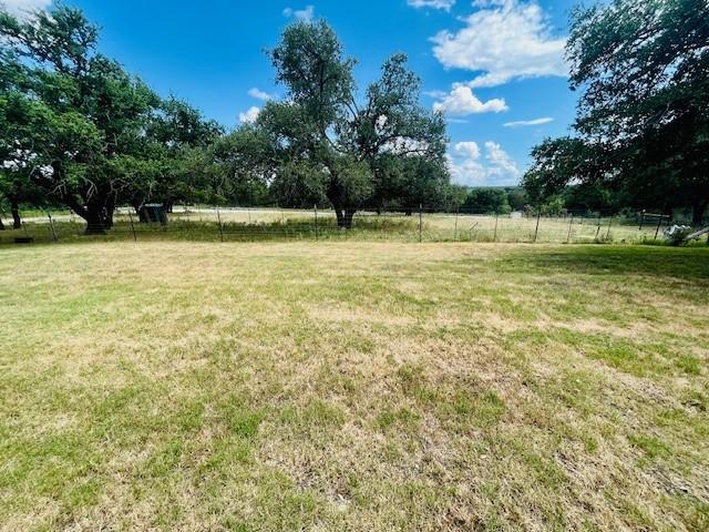 view of yard with a rural view