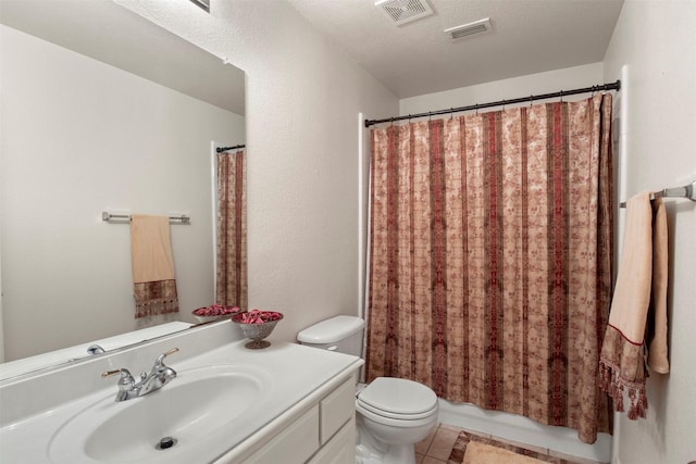 bathroom with tile patterned floors, visible vents, toilet, and vanity