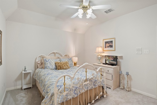 bedroom with a ceiling fan, visible vents, baseboards, lofted ceiling, and light colored carpet