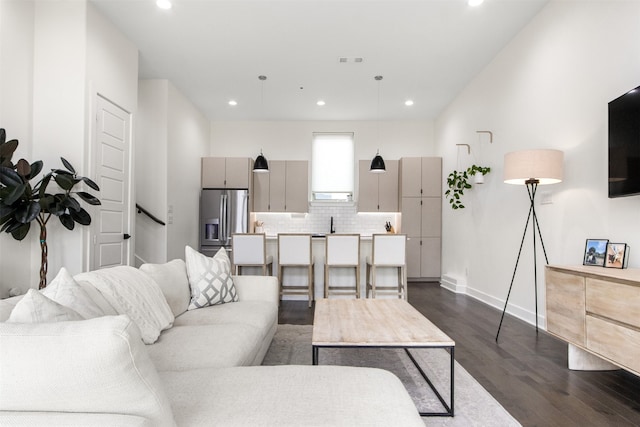 living room featuring dark wood-type flooring