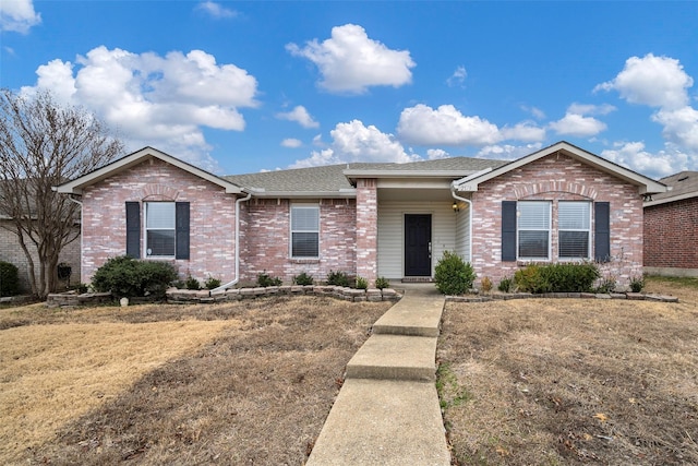 ranch-style house with a front lawn