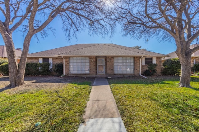 ranch-style home featuring a front yard