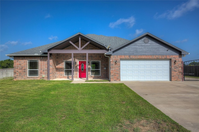 view of front of home featuring a garage and a front lawn