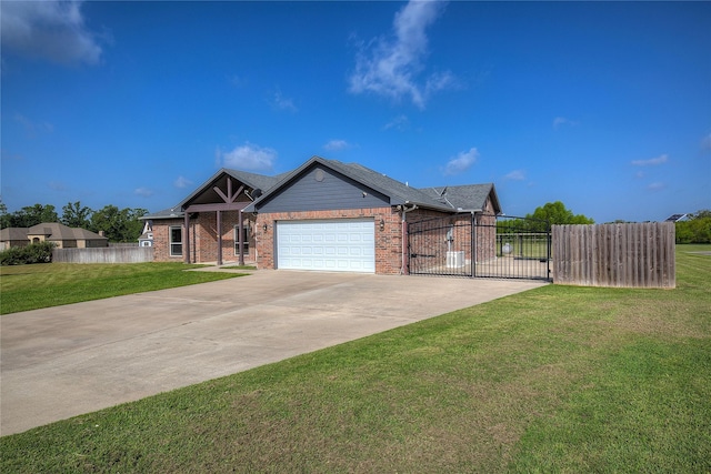 view of front of house with a garage and a front lawn