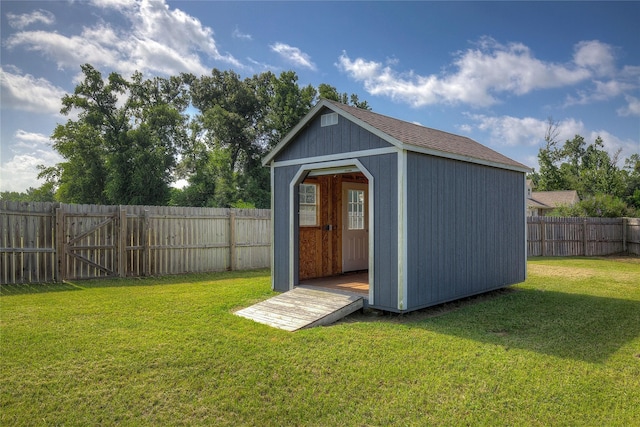 view of outdoor structure with a lawn